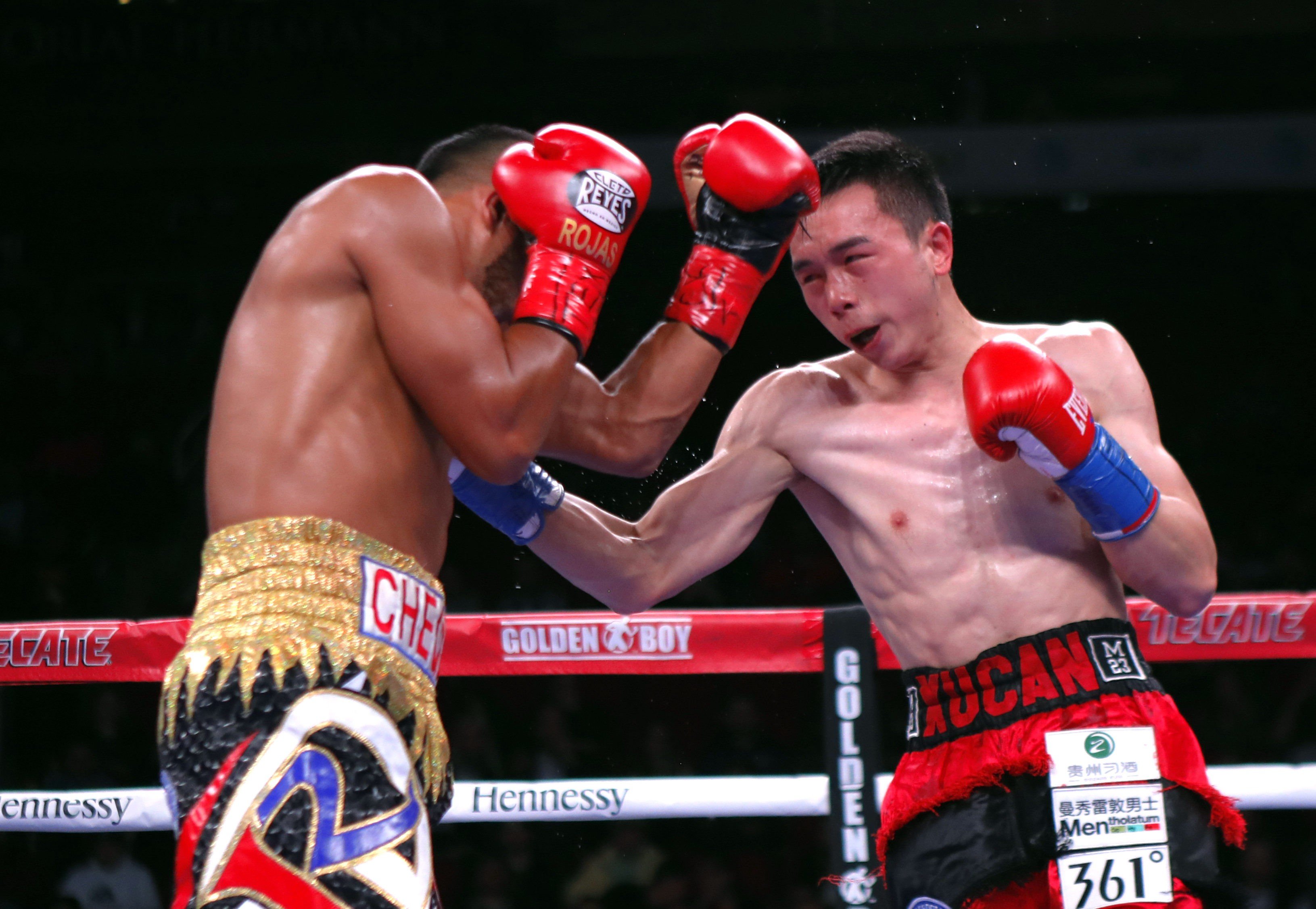 China’s Xu Can (right) on his way to victory against Puerto Rico’s Jesus Rojas for the WBA featherweight title in Houston, Texas in January. Photo: Xinhua