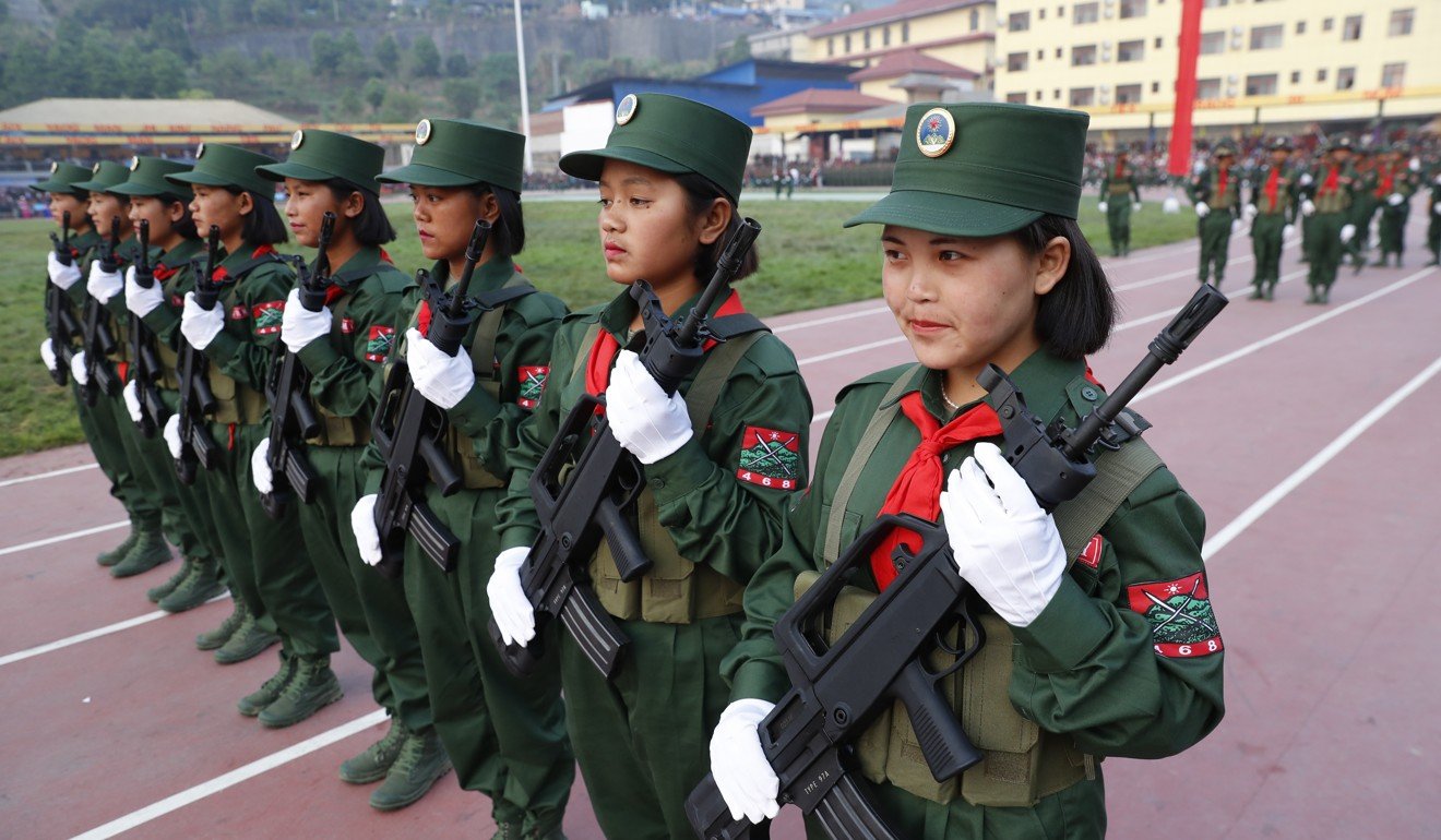 Young female soldiers of UWSA practice the formation for a parade held to mark the 30th anniversary of Wa State in Panghsang, also called Pang Kham of autonomous Wa region. Photo: EPA-EFE