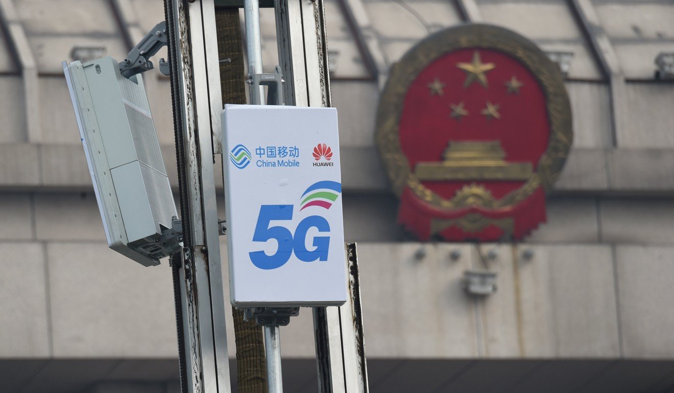 5G antenna units with logos of China Mobile and Huawei are seen in front of a National People’s Congress conference centre in Luoyang, Henan province, on February 27. Photo: Reuters