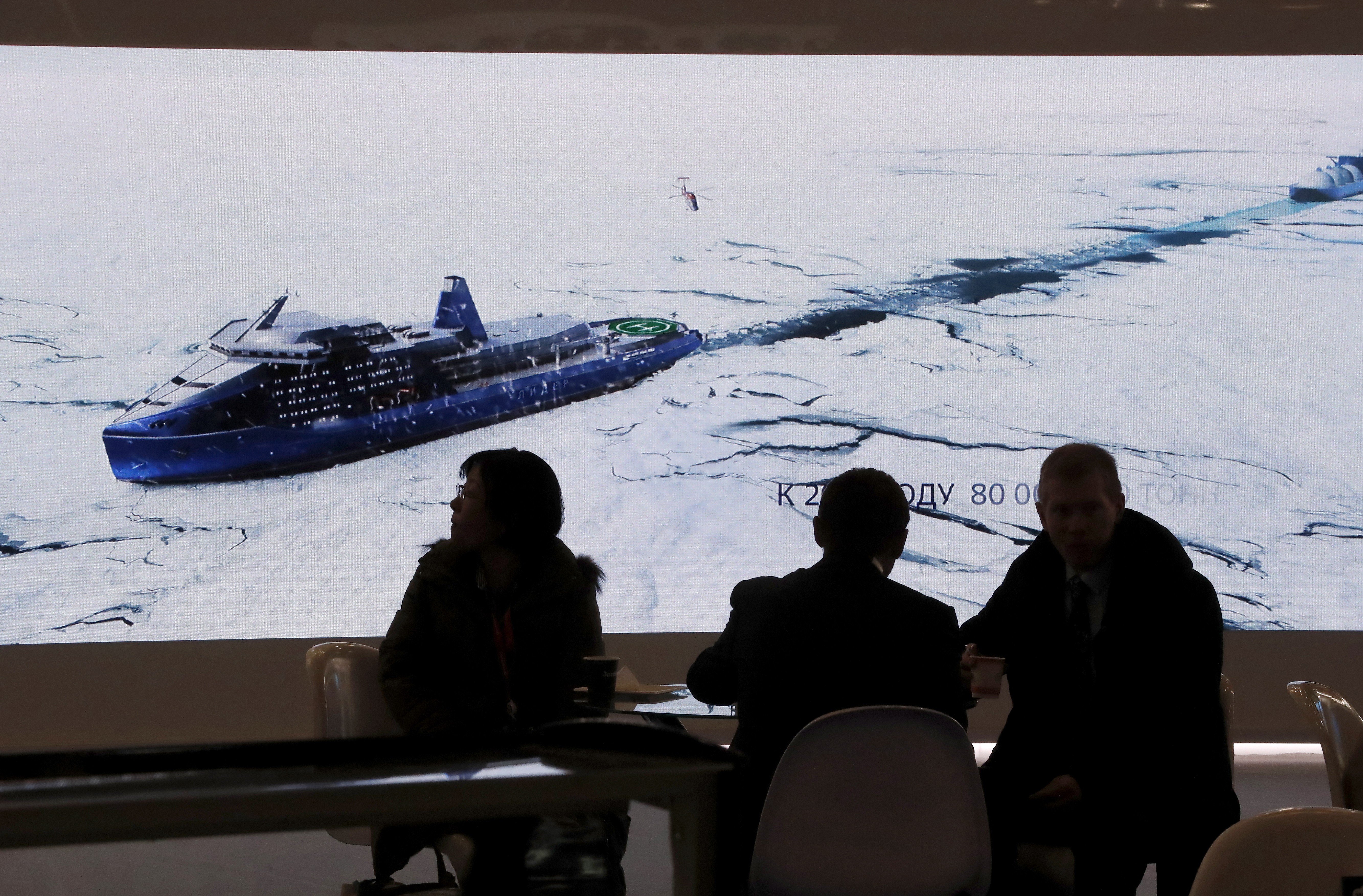 Delegates watch footage of an icebreaker at the International Arctic Forum in Russia earlier this month. Photo: EPA-EFE