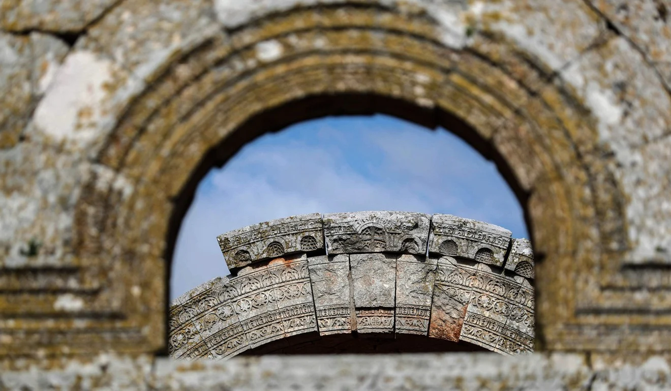 An adorned arc at the 5th century basilica in Qalb Lozeh village in northwestern Syria on Thursday. Photo: AFP