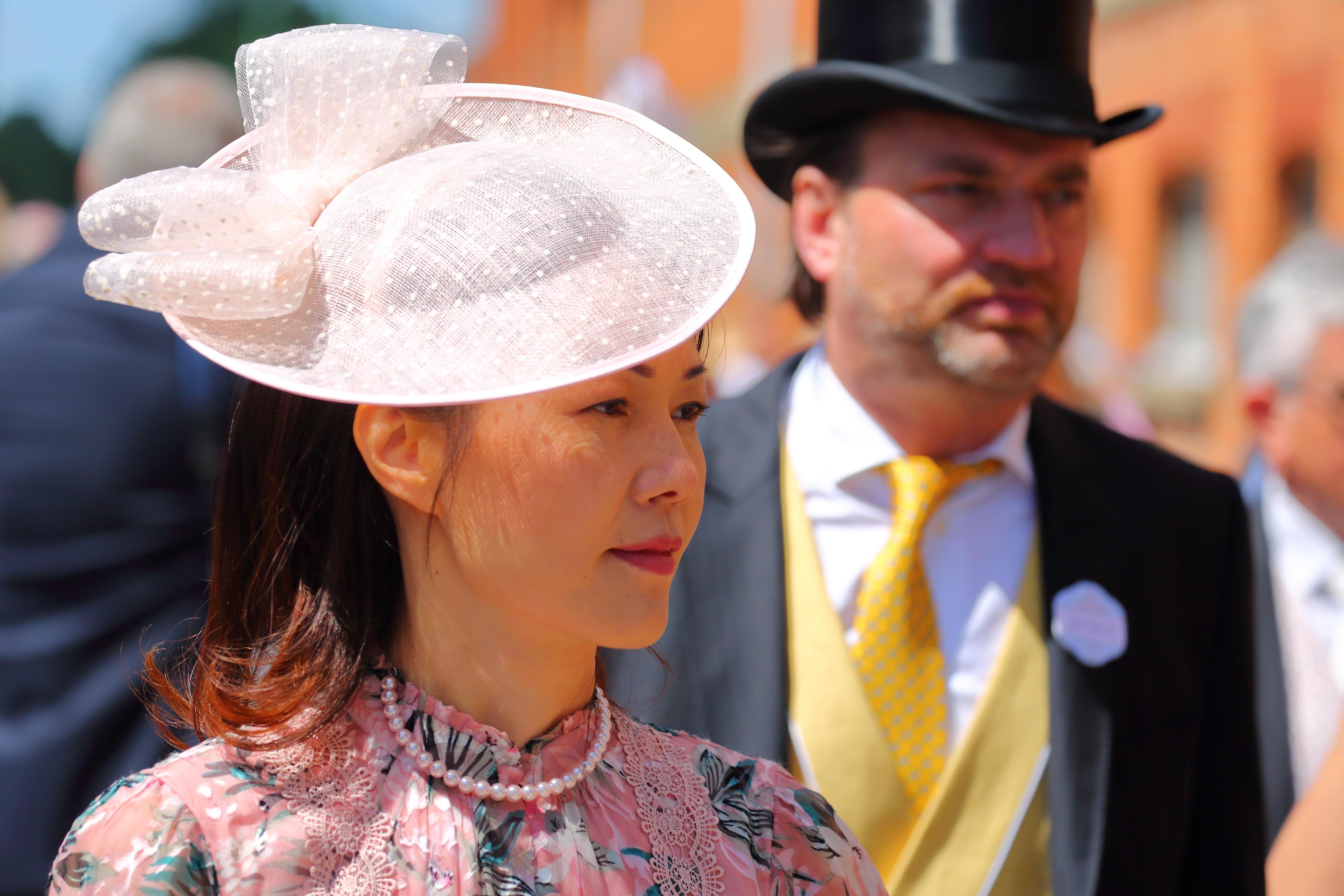 Hats are de rigueur at Royal Ascot, but if your headgear is extravagant, tone down the rest of your outfit, advises Ada Yi Zhao of curated-crowd.com, one of our guides to dressing for the British social season. Photo: Uwe Deffner/Alamy Live News