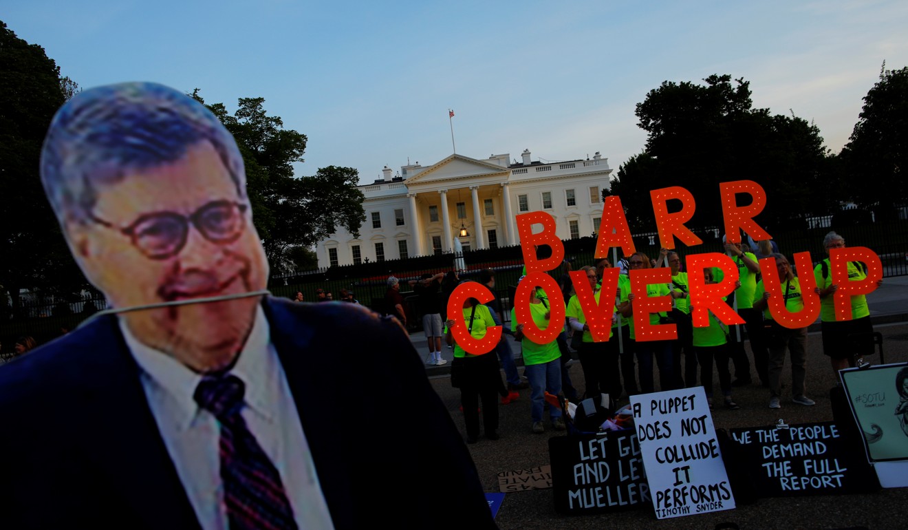 A cardboard cutout of US Attorney General William Barr is seen as protesters hold signs that read ‘Barr Coverup’ at the White House on Thursday. Photo: Reuters