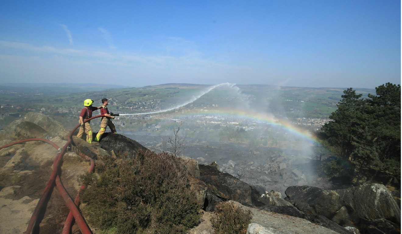 Firefighters on Ilkley Moor in West Yorkshire on Sunday April 21, 2019. Photo: AP