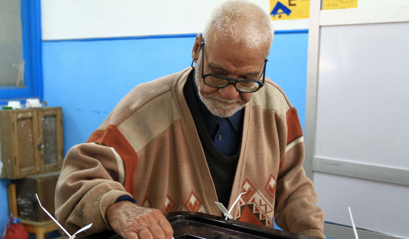 An Egyptian man casts his vote at a polling station in the Mediterranean port city of Alexandria. Photo: AFP