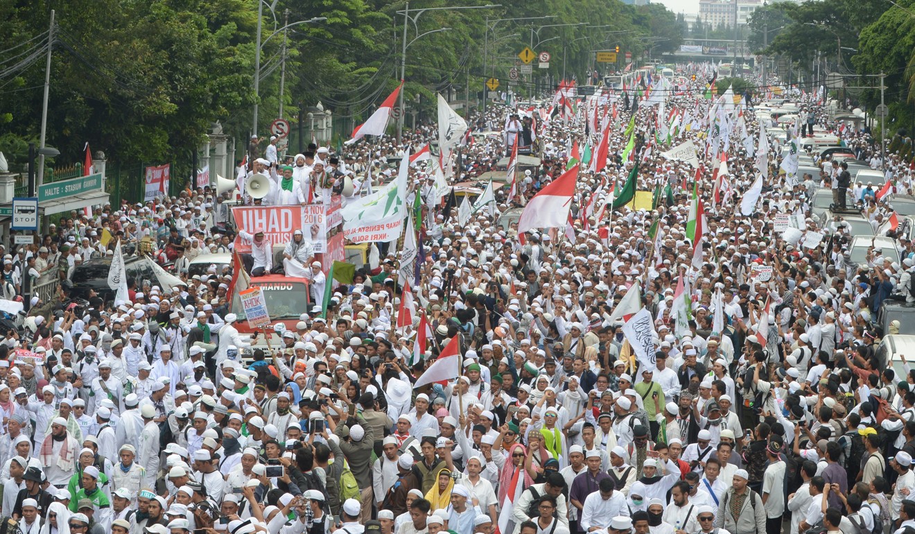 Indonesian Muslims marched against Jakarta’s ethnic Chinese mayor Basuki Tjahaja Purnama, alias Ahok, accusing him of blasphemy, on November 4, 2016. The Ahok effect is still visible in the 2019 election. Photo: AFP