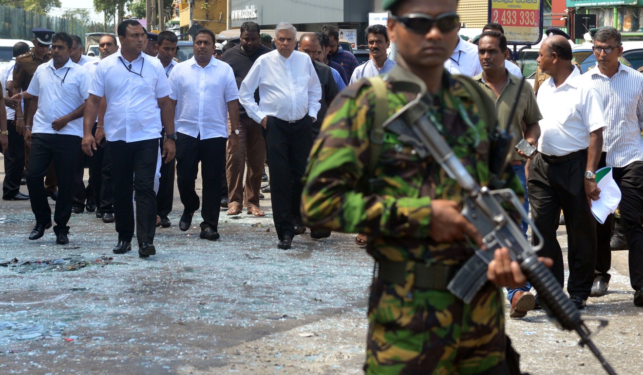 Sri Lankan Prime Minister Ranil Wickremesinghe (centre) arrives to visit the site of a bomb attack at St Anthony’s Shrine in Kochchikade in Colombo on April 21, 2019. Photo: AFP