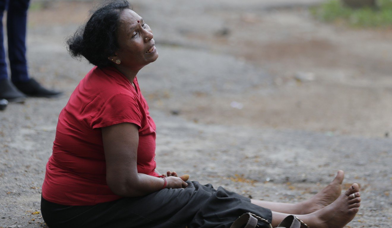 A relative of a blast victim grieves outside a morgue in Colombo. Photo: AP