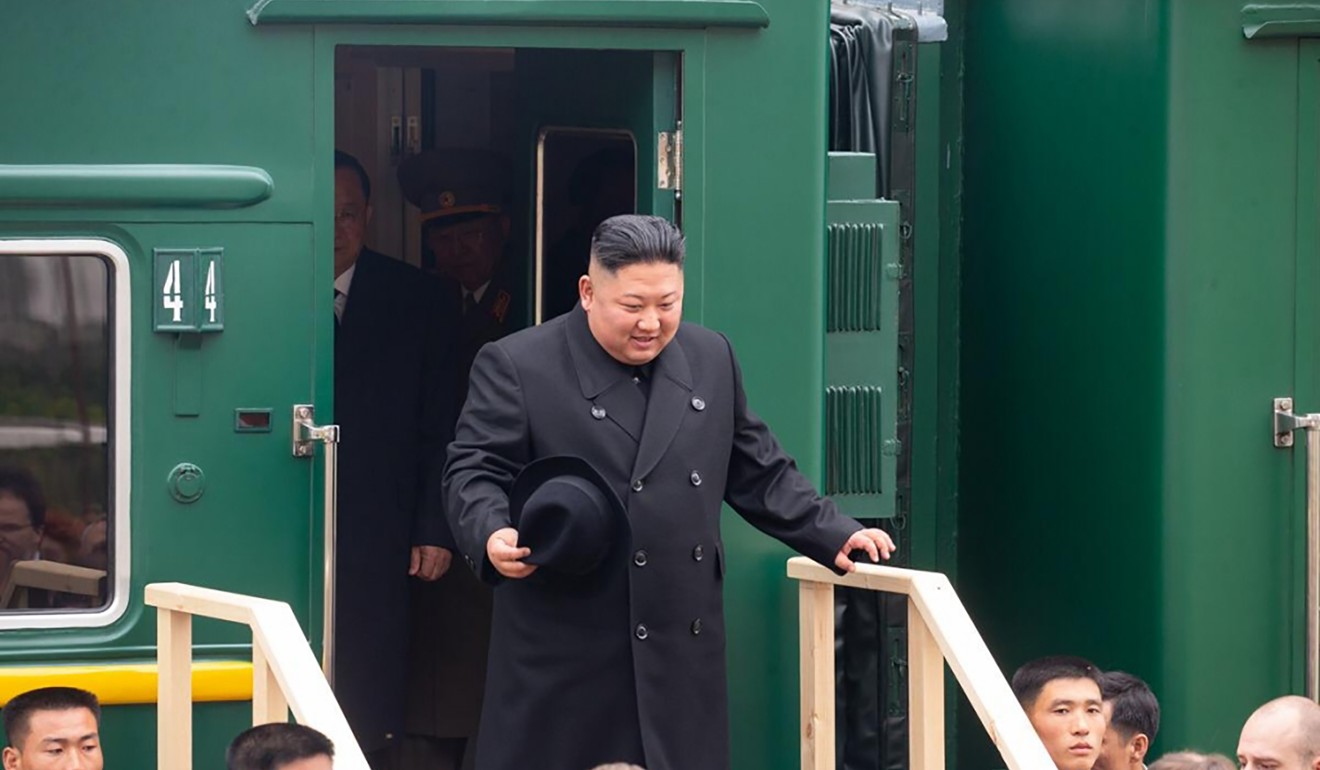 Kim disembarking from his private train at a station in the Russian border town of Khasan. Photo: AFP