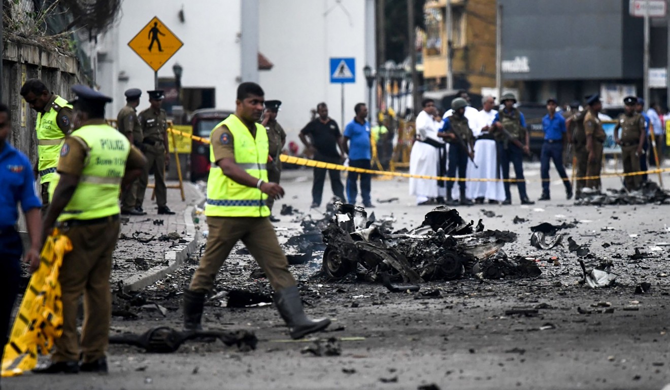 Sri Lankan security personnel inspect the aftermath of an explosion near St. Anthony's Shrine in Colombo. Photo: AFP