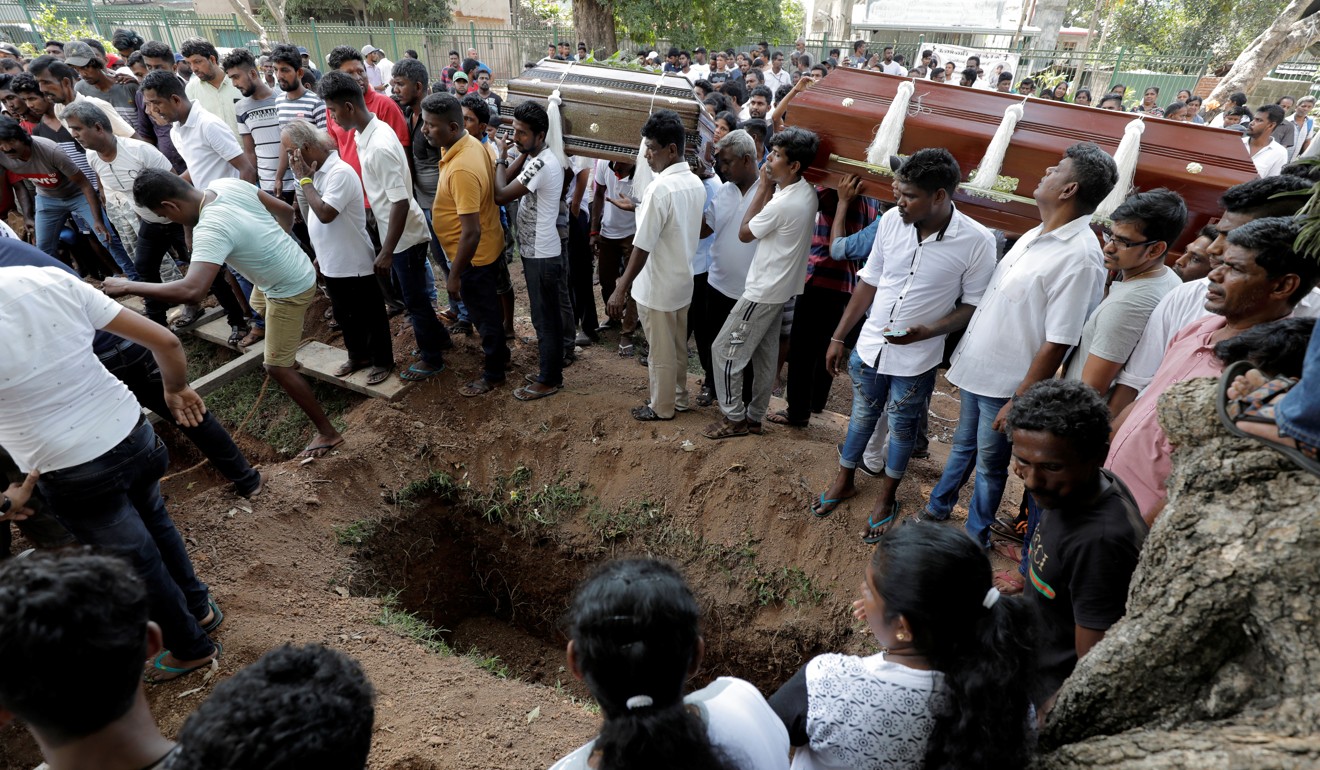 Burials are held for victims of Sunday’s attacks. Photo: Reuters