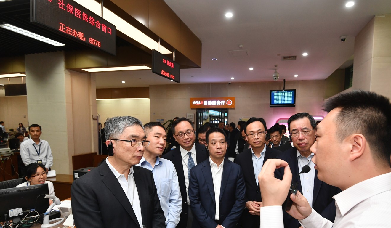 Hong Kong lawmakers visit the Hangzhou Public Service Center on Tuesday as part of a four-day tour. Photo: Handout