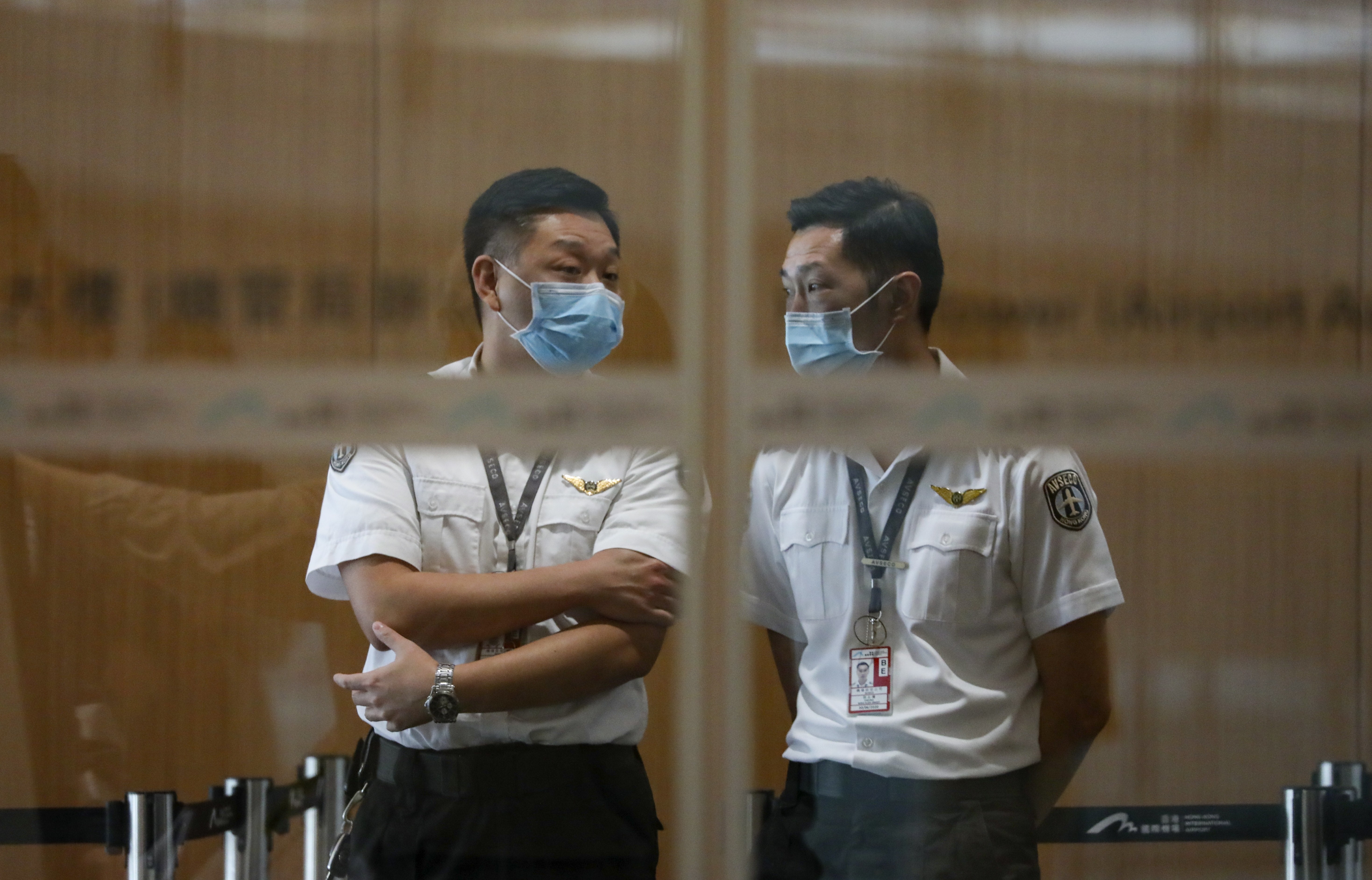 Airport security staff at the Hong Kong International Airport wear face masks during the measles outbreak. Photo: Felix Wong