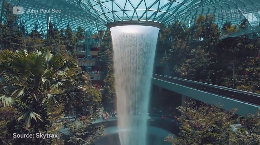 The HSBC Rain Vortex at the newly-opened Jewel Changi. The cascading funnel of water drops seven stories through the core of the structure. Image: Screengrab from Business Insider’s Changi Airport video