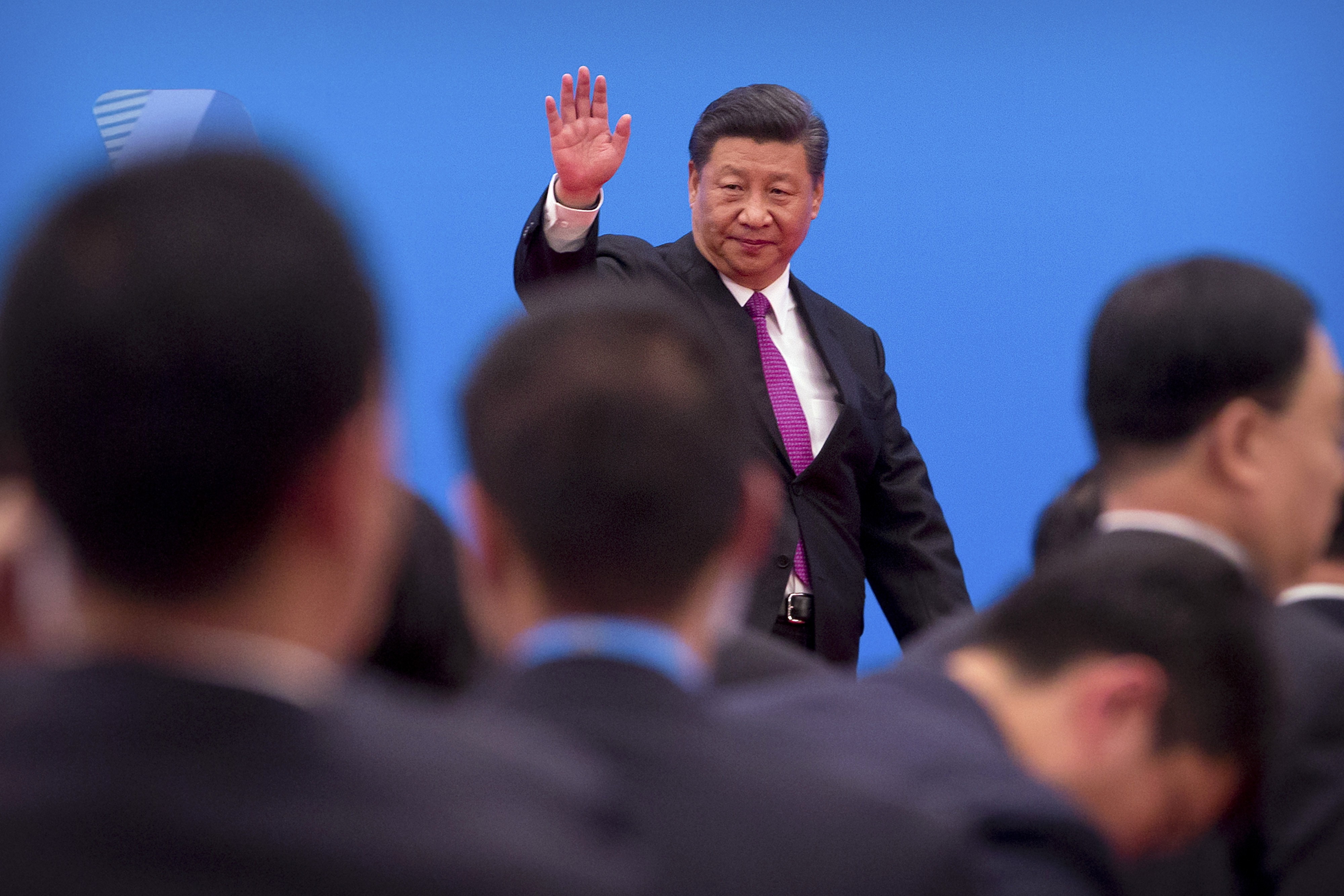 Xi Jinping waves as he leaves after a press conference at the closing of the Belt and Road Forum in Beijing on Saturday. Photo: AP