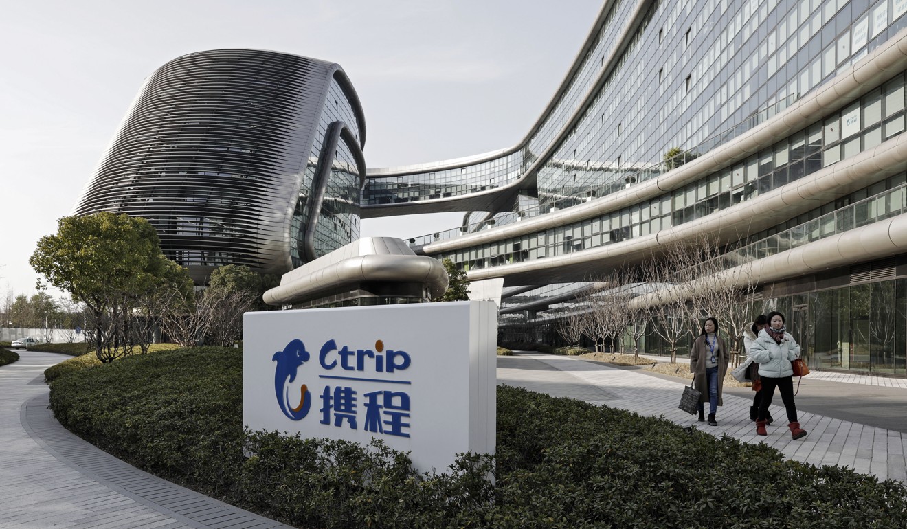 A sign for Ctrip is displayed outside the Sky Soho building, which hosts the company's headquarters, in Shanghai. Photo: Bloomberg