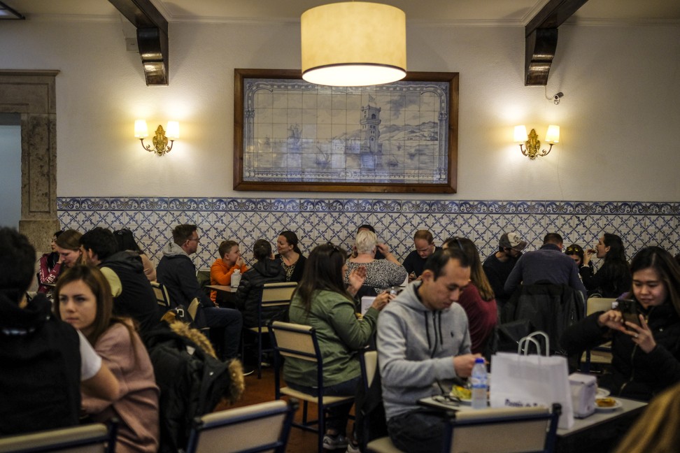 Customers eat at Pasteis de Belem cafe. Photo: Bloomberg