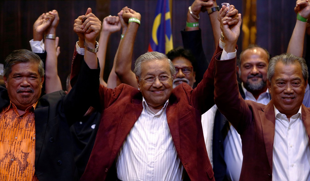 Mahathir Mohamad and allies celebrate after last year’s election. Photo: Reuters