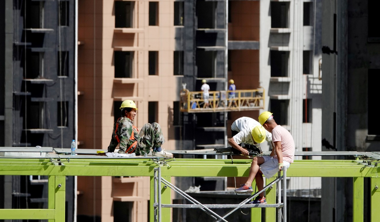 Construction workers at work on residential buildings in Zhengzhou, Henan province, in September last year. China’s economy has shown some signs of picking up, and the engine of growth may not have been manufacturing but other sectors, such as properties and infrastructure spending. Photo: Reuters