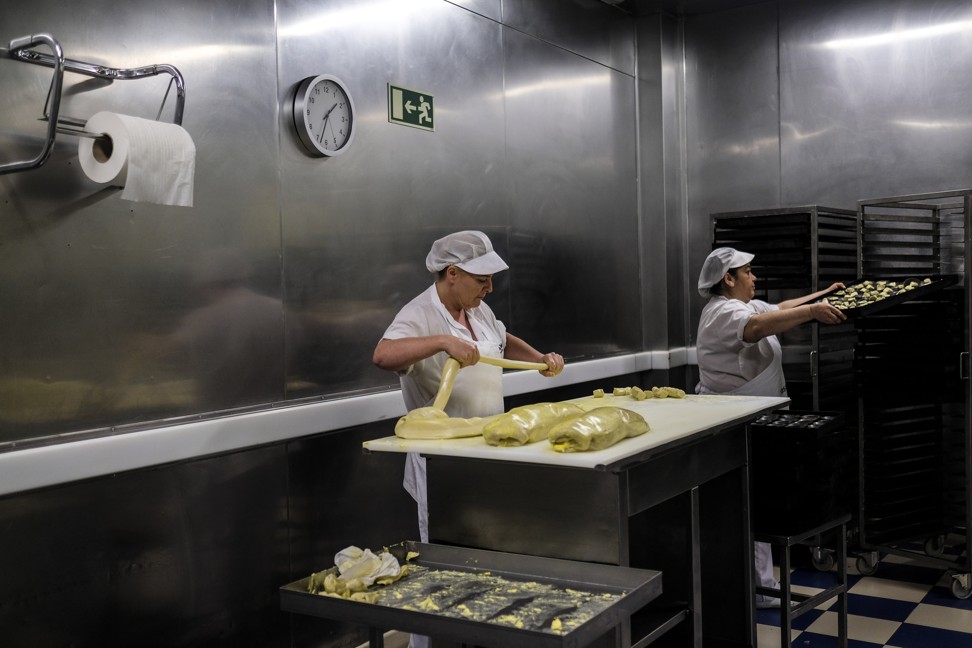 A baker prepares the pastry for pastel de nata pastries at the Pasteis de Belem cafe. Photo: Bloomberg