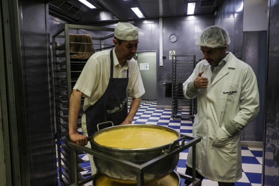 A baker prepares the filling for pastel de nata pastries at the Pasteis de Belem cafe. Photo: Bloomberg