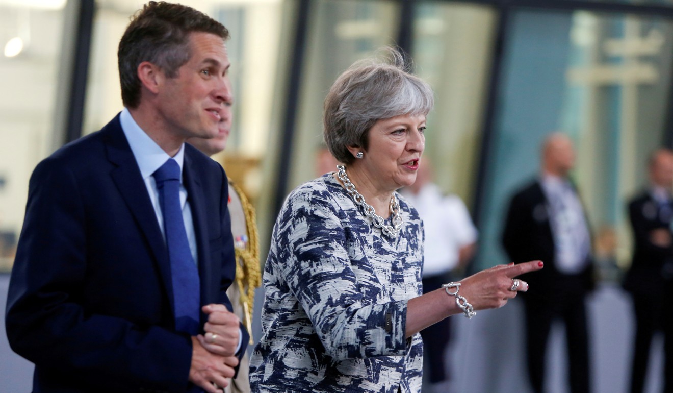 Britain's Prime Minister Theresa May and Defence Minister Gavin Williamson arrive for a meeting in Brussels in July 2018. Photo: Reuters