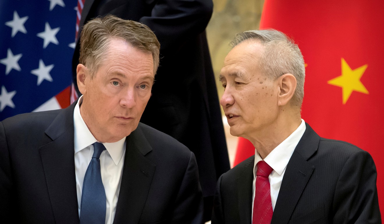 US Trade Representative Robert Lighthizer (left) listens as Chinese Vice-Premier Liu He talks while they line up for a group photo at the Diaoyutai State Guesthouse in Beijing in February. Photo: Reuters