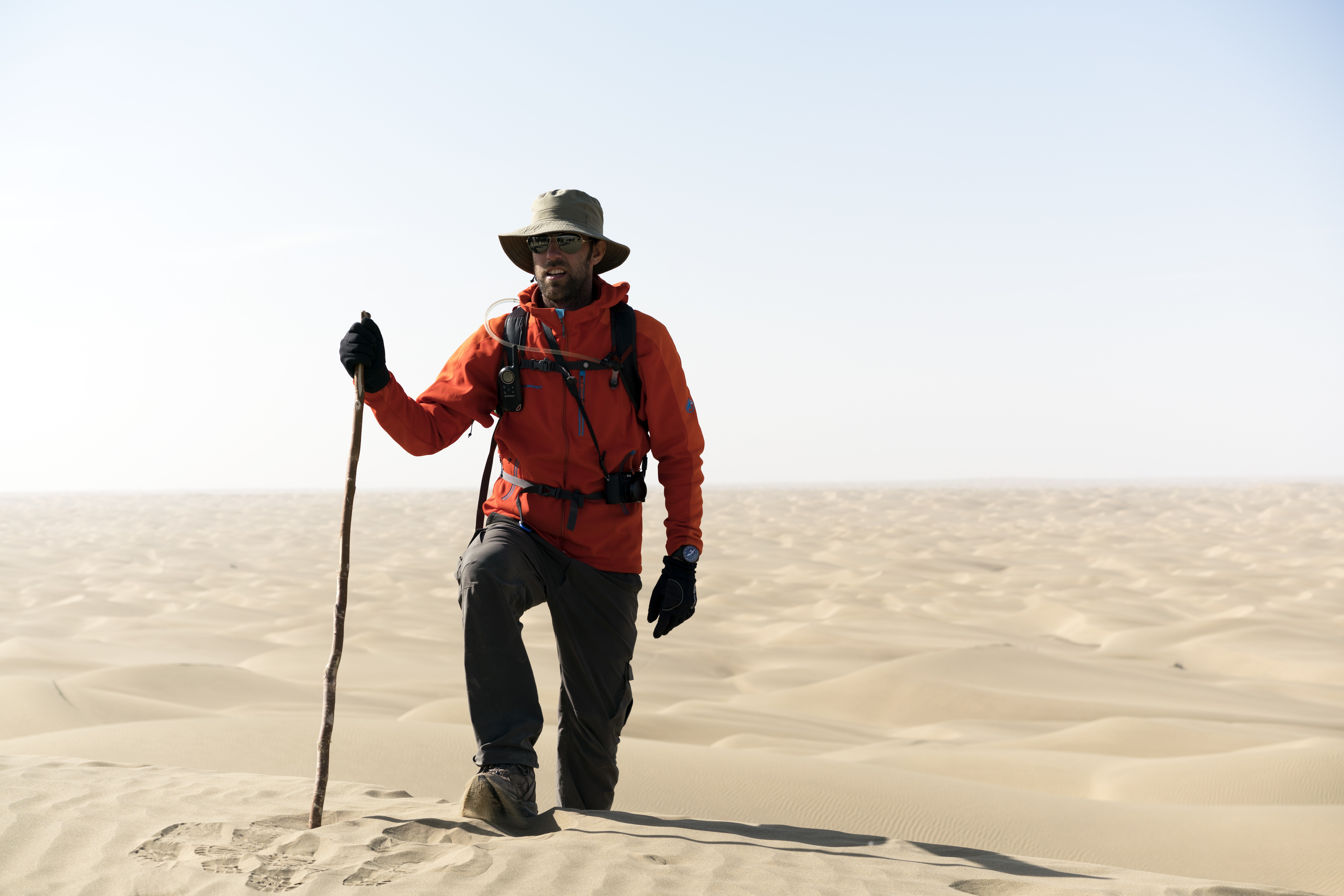 Ryan Pyle treks through the Taklamakan Desert in China while filming his television series Extreme Treks on BBC Earth.