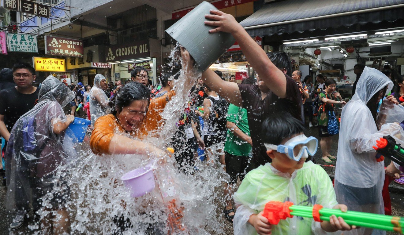 A woman gets splashed during the Songkran Festival in Kowloon City. Photo: Winson Wong