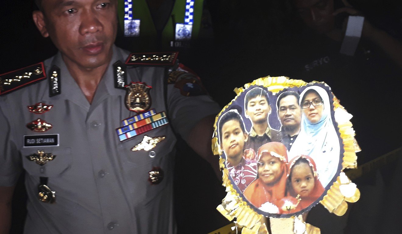 Surabaya police show a picture of the family of Dita Oepriarto who carried out the May 2018 suicide attacks. Photo: AP