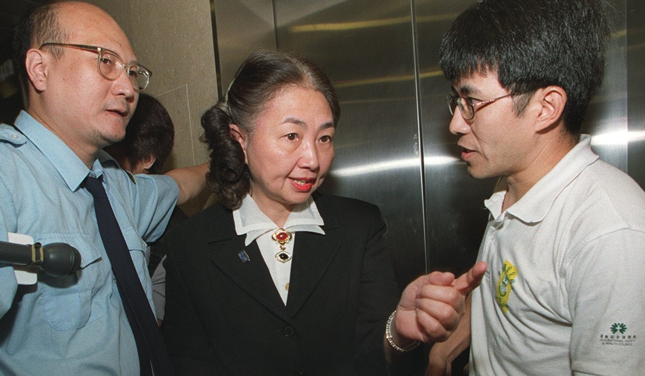 Elsie Leung, then Hong Kong’s secretary for justice, talks with Chan Kam-hong.