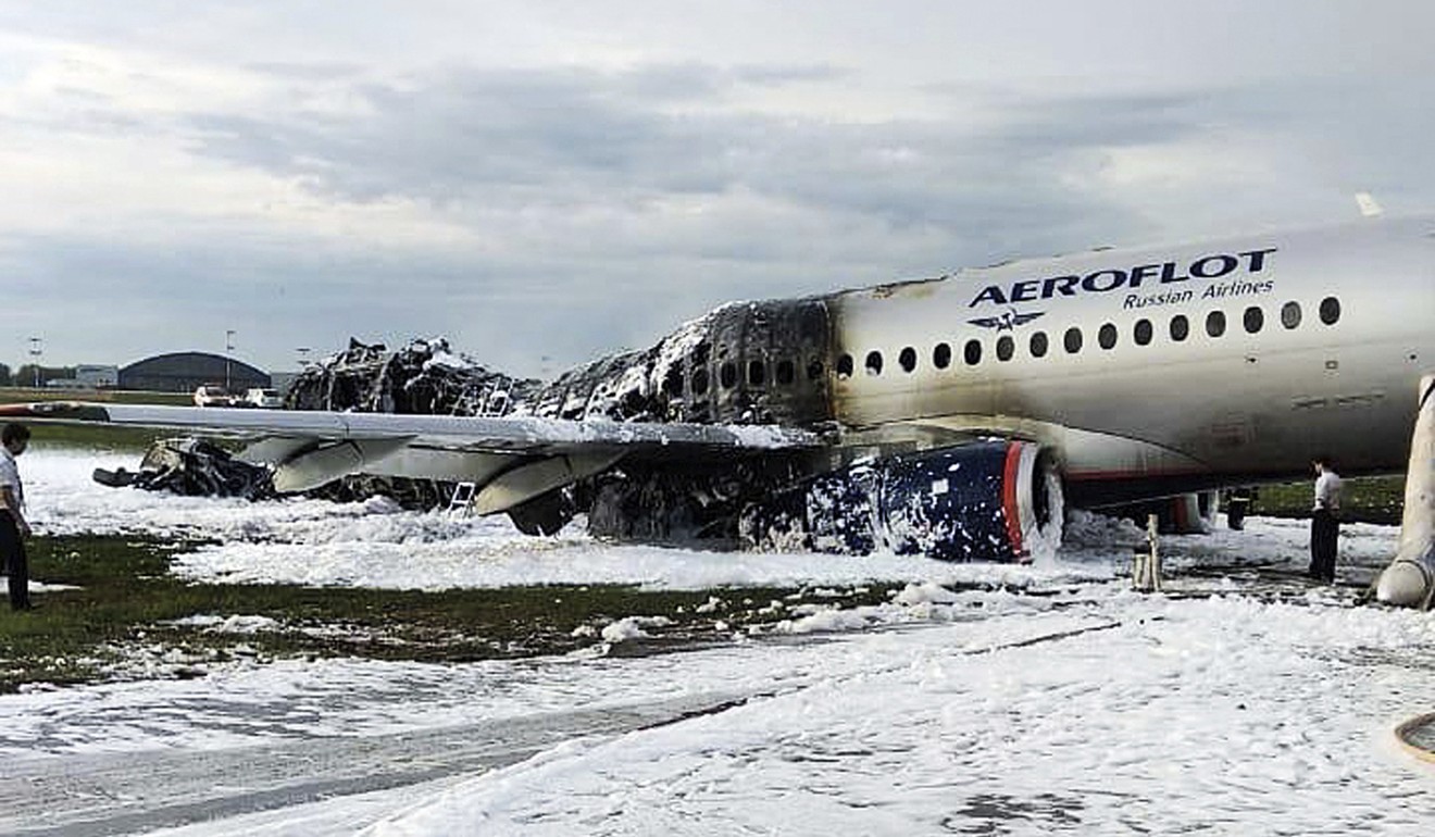 The Sukhoi SSJ100 aircraft covered in fire retardant foam. Photo: AP