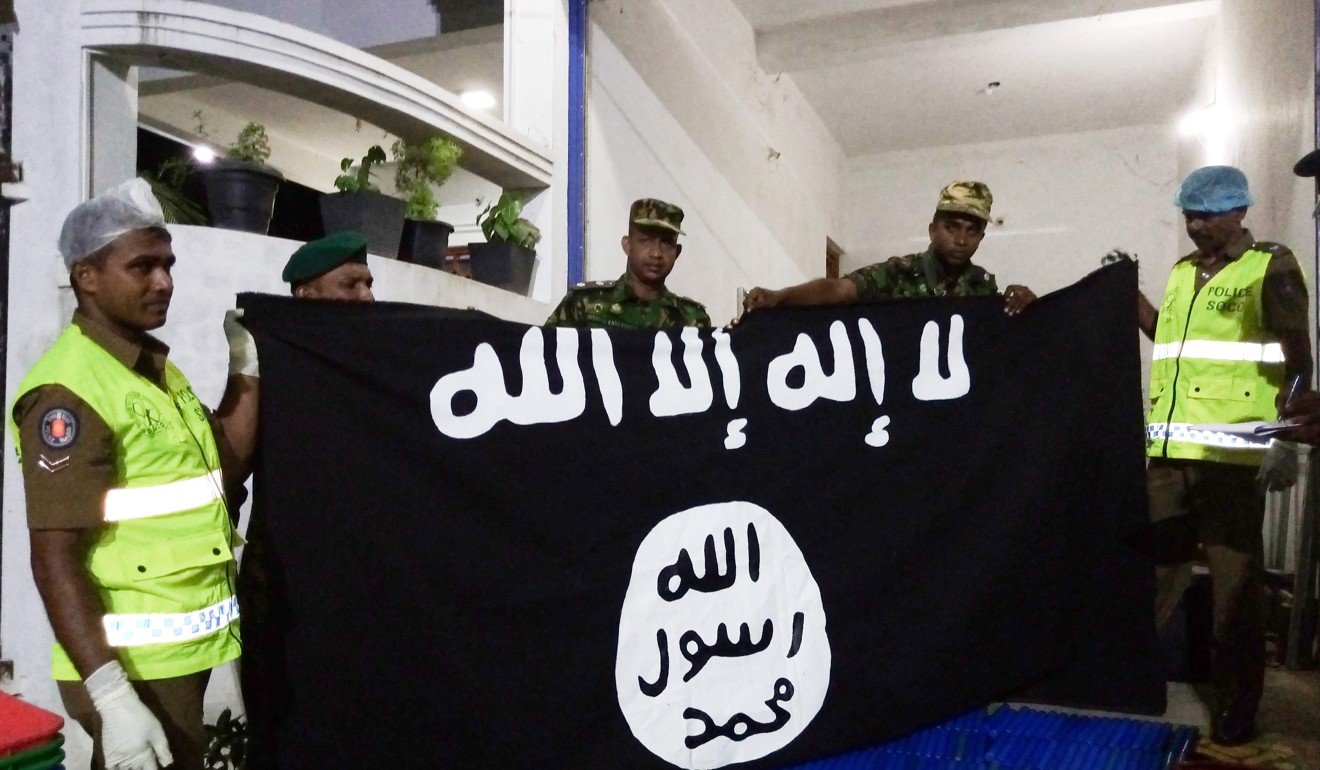 Security personnel display seized items after they raid what believed to be an Islamist safe house in the eastern town of Kalmunai, Sri Lanka, after the Easter Sunday suicide bombings. Photo: AFP