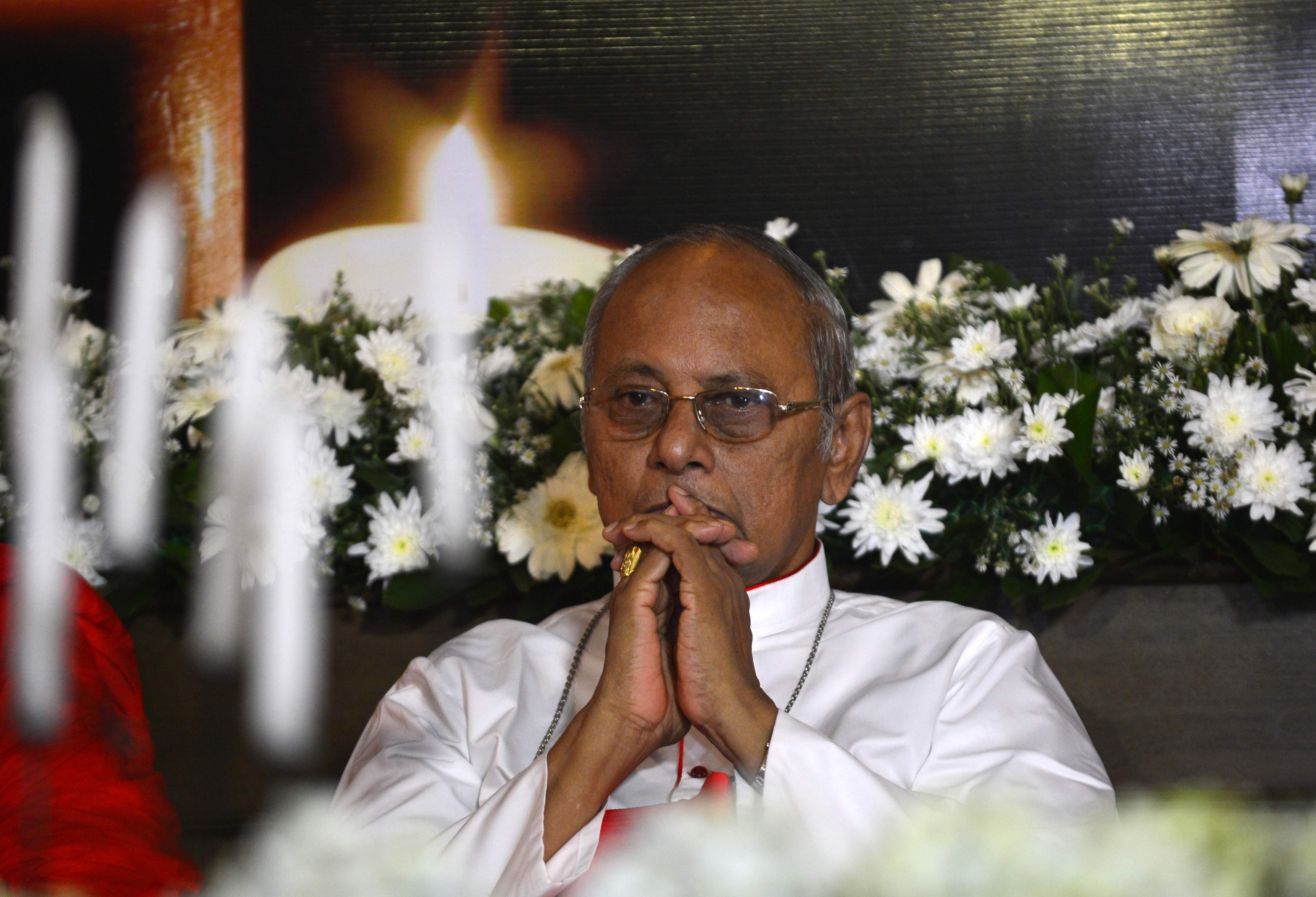 Cardinal Malcolm Ranjith at a candlelight vigil in memory of bombing victims in Colombo on Sunday. Photo: AFP