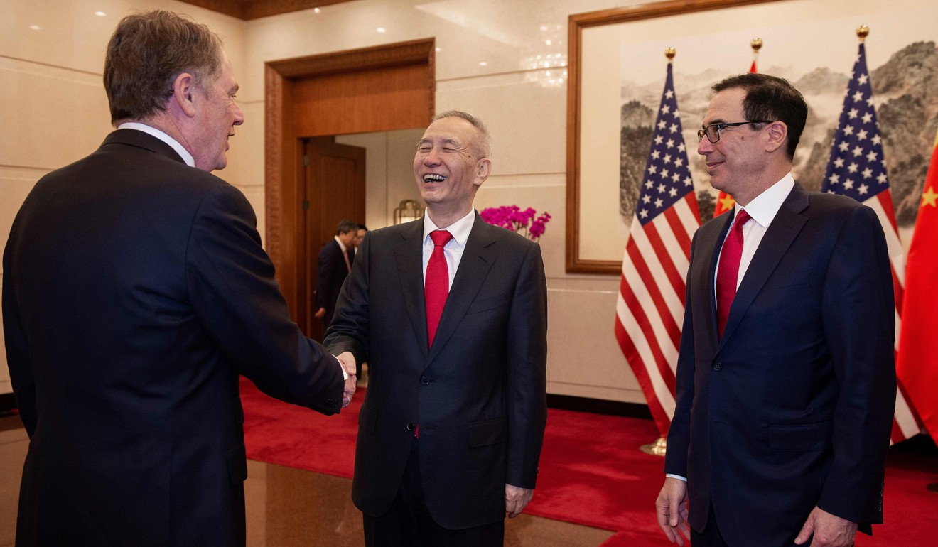 Chinese Vice-Premier Liu He shake hands with US Trade Representative Robert Lighthizer (left) as US Treasury Secretary Steven Mnuchin looks on in Beijing on March 29. Photo: AFP