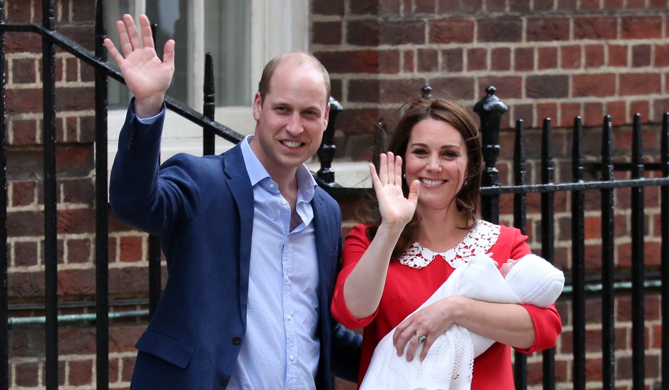 Britain’s Prince William, Duke of Cambridge (left) and his wife, Catherine, Duchess of Cambridge, wave to waiting crowds after the birth of their first child, Prince George, in July 2013. Photo: AFP