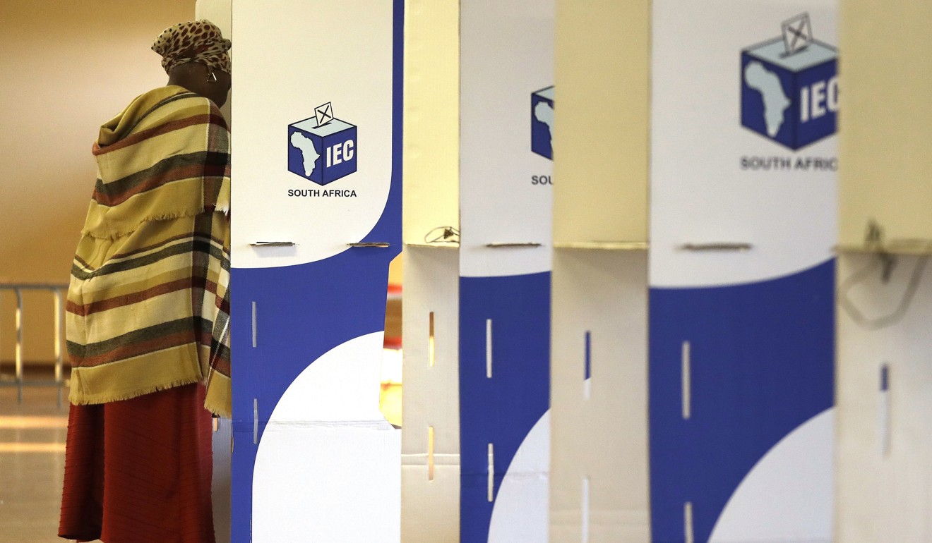 A woman stands in a voting booth at a polling station during elections at KwaMhlanga in Mpumalanga. Photo: AP