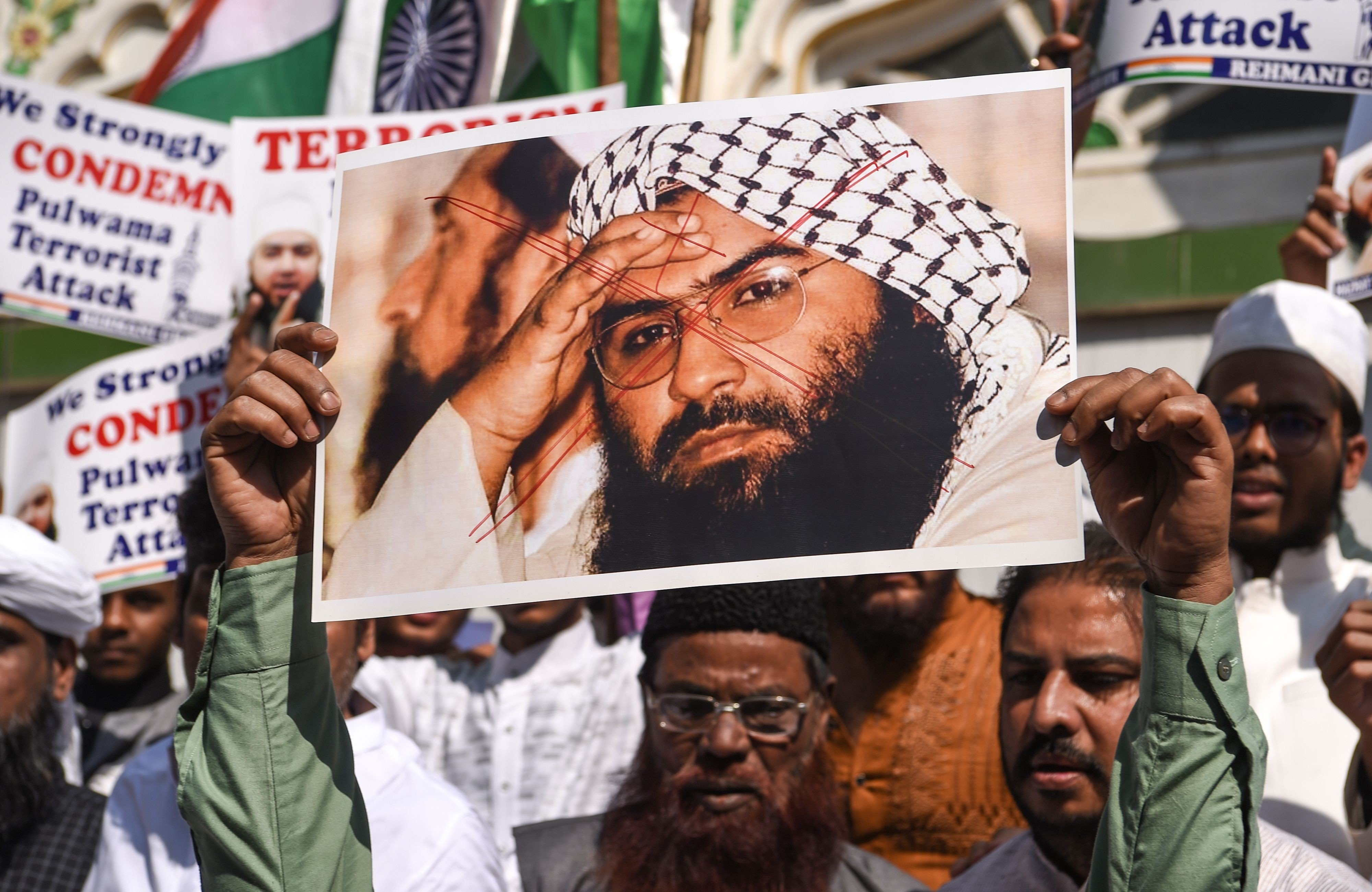 Indian Muslims with photo of Jaish-e-Mohammad chief, Masood Azhar, at an anti-Pakistan protest in Mumbai. Photo: AFP
