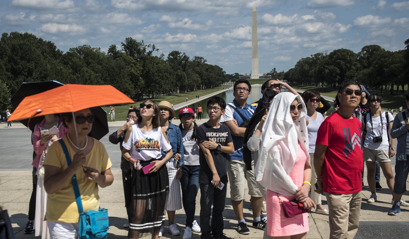 Chinese tourists near the Lincoln Memorial in Washington. If there is no resolution to the trade war, China could retaliate by limiting visas to the US. Photo: Washington Post