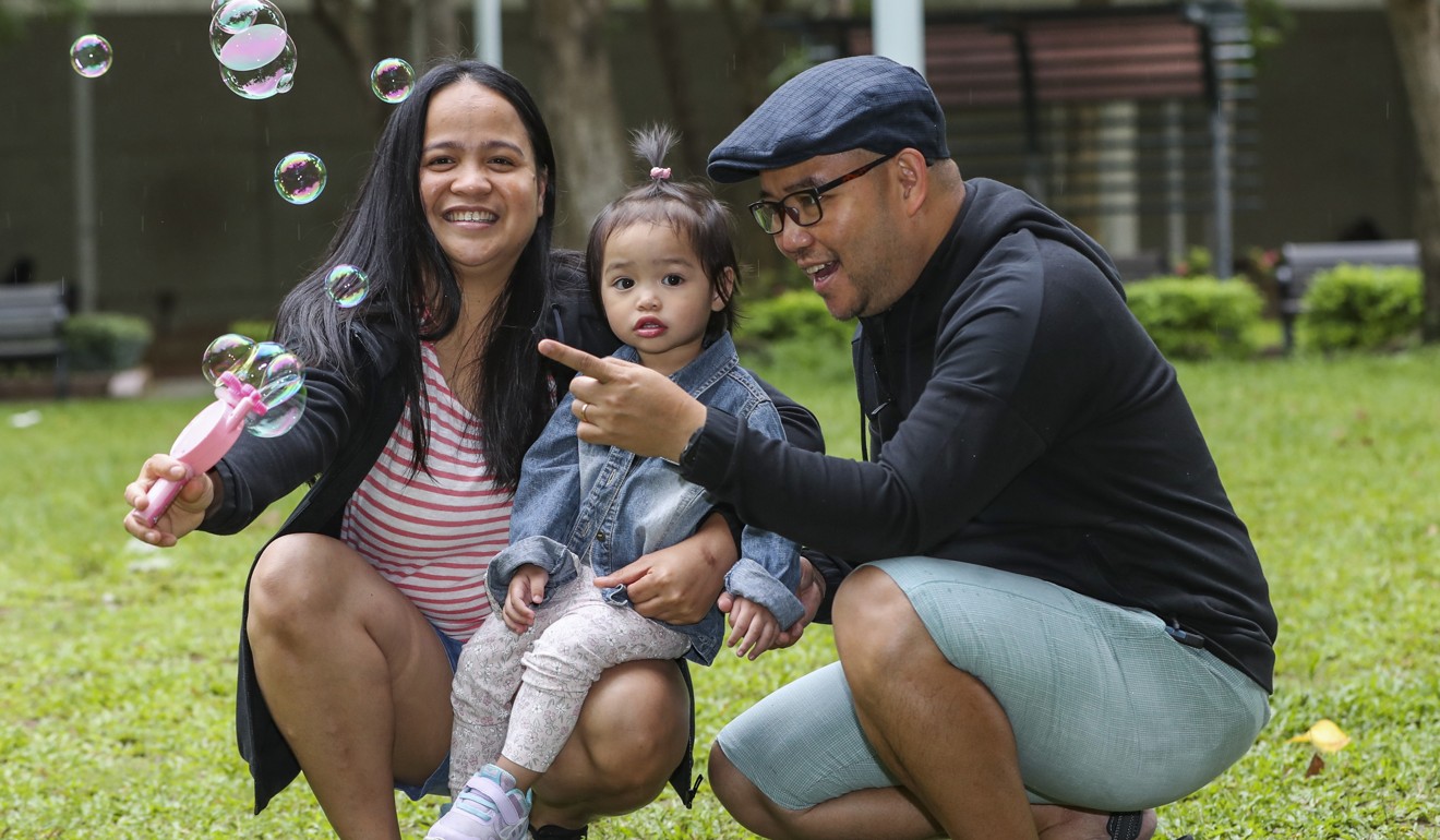 Lalay Villanueva and Eman Villanueva with their daughter Elca. Photo: Edward Wong