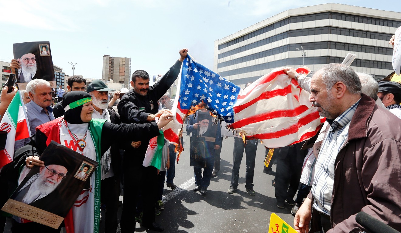 Demonstrators burn US flag during an anti-US rally. Photo: EPA-EFE