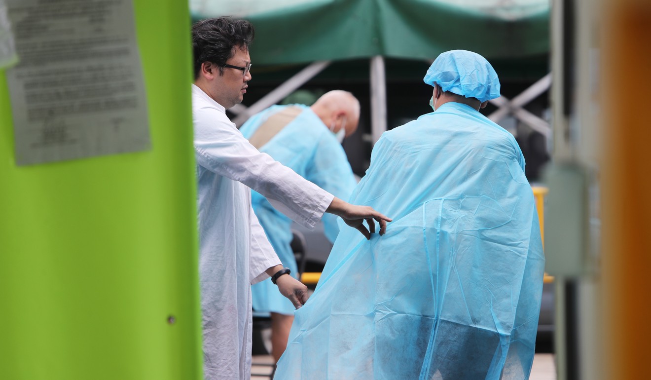Staff in protective gear at Sheung Shui slaughterhouse. Photo: Winson Wong