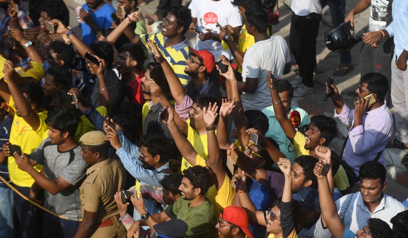 Fans of IPL cricket side Chennai Super Kings wait for the team bus. Photo: AFP