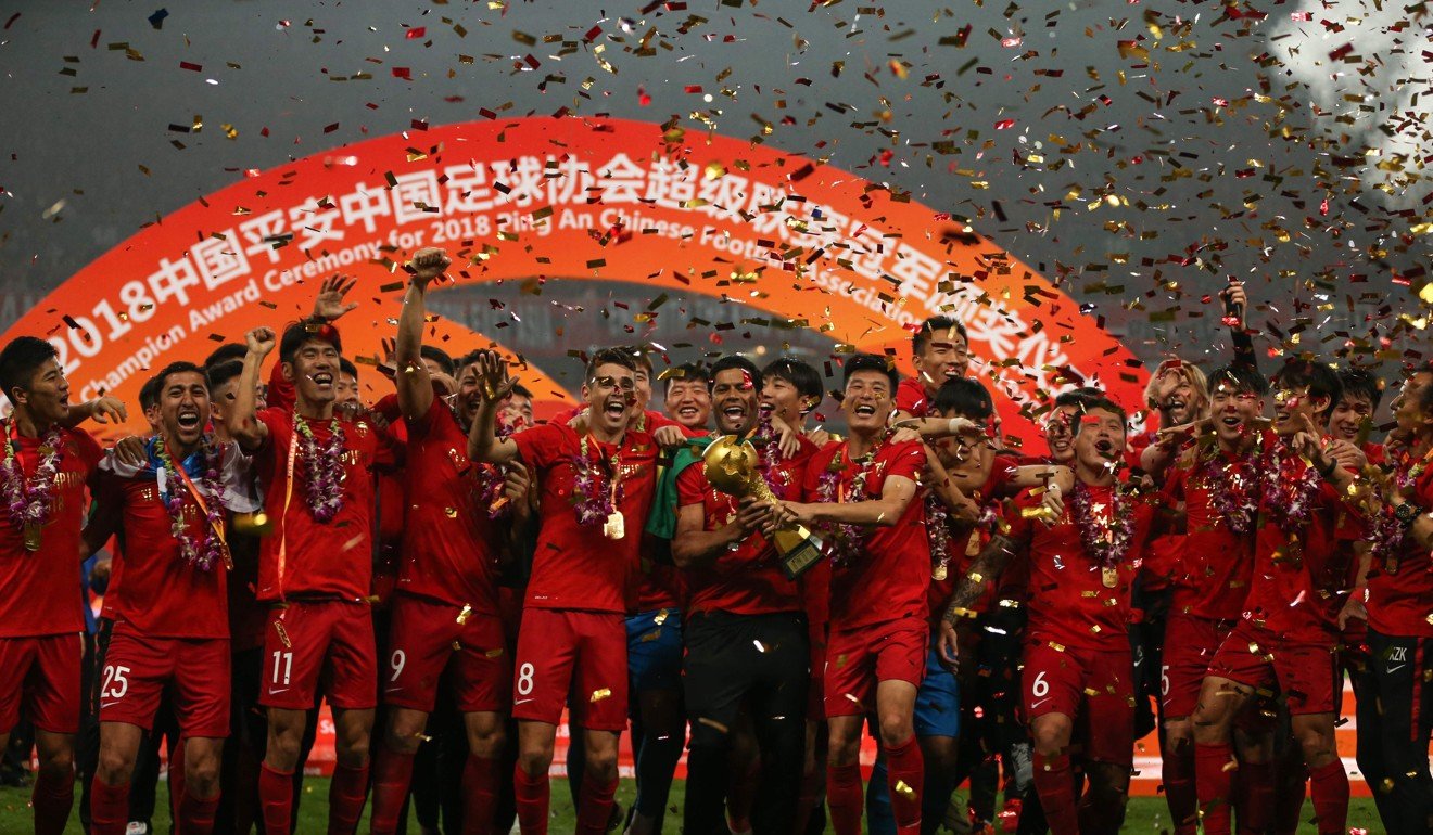 Shanghai SIPG celebrate with their trophy after winning the 2018 Chinese Super League title. Photo: AFP