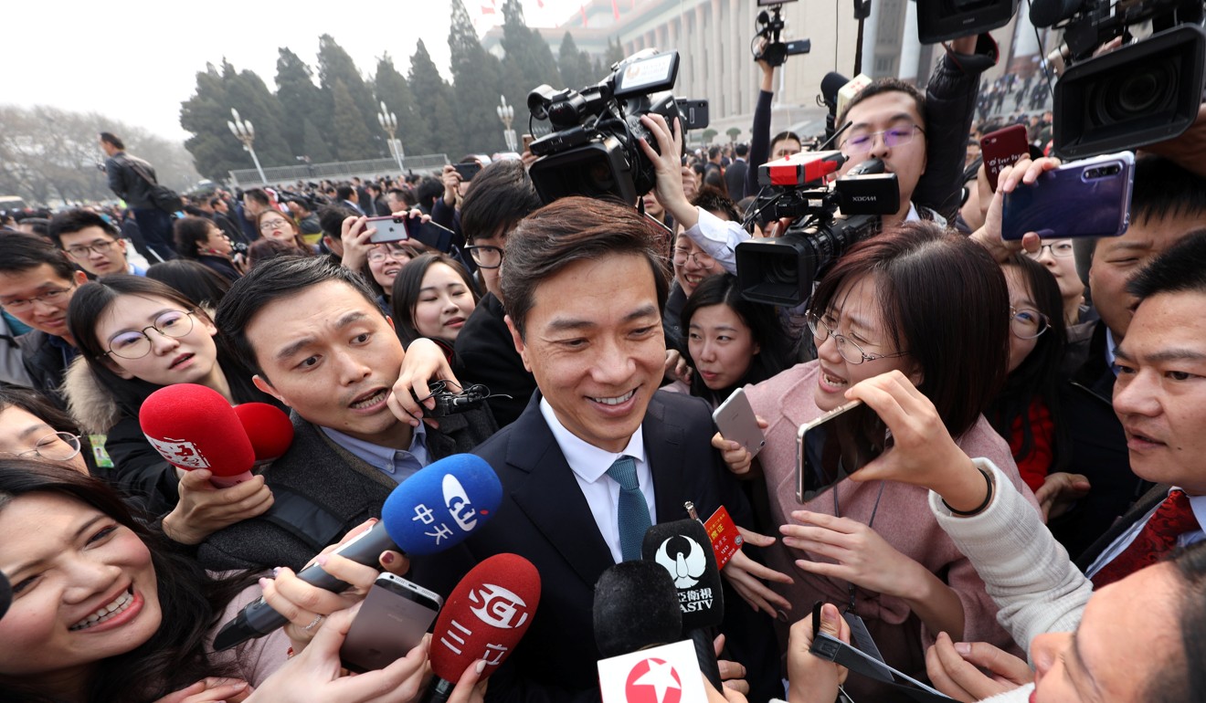 CPPCC member and Baidu's Chief Executive Officer (CEO) Robin Li speaks to the media as he arrives for the opening session of the Chinese People's Political Consultative Conference (CPPCC) at the Great Hall of the People in Beijing, China March 3, 2019. Photo: Reuters