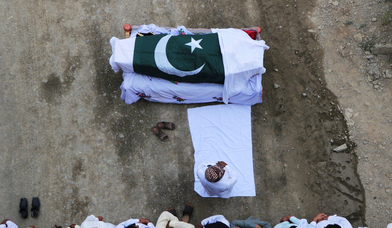 The funeral of Awais Ali Shah, a security supervisor killed after separatist insurgents attacked a luxury hotel in the port city of Gwadar. Photo: Reuters