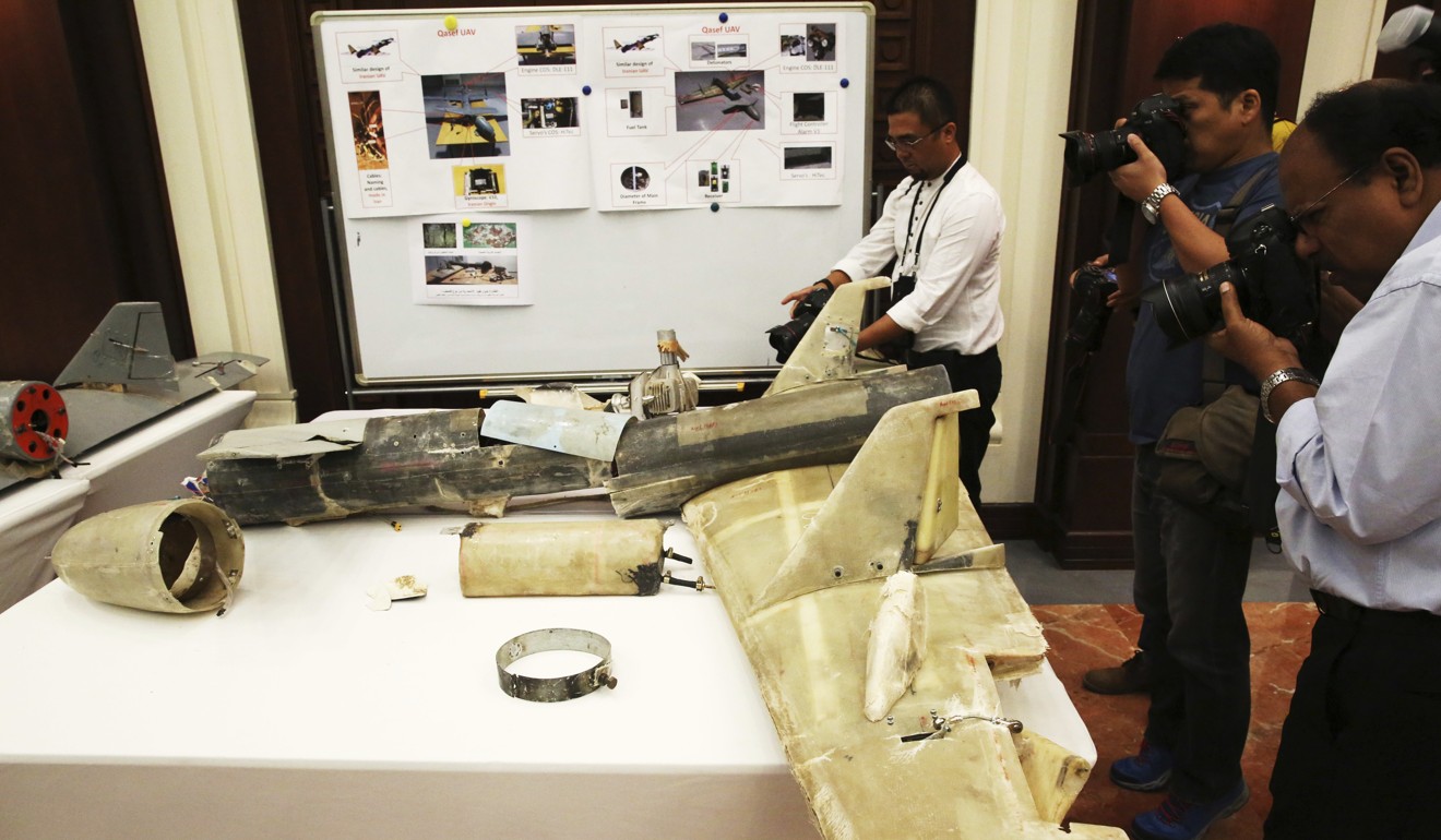 In this June 19, 2018 file photo, photographers take pictures of what UAE officials described as an Iranian Qatef drone captured on the battlefield in Yemen. File photo: AP