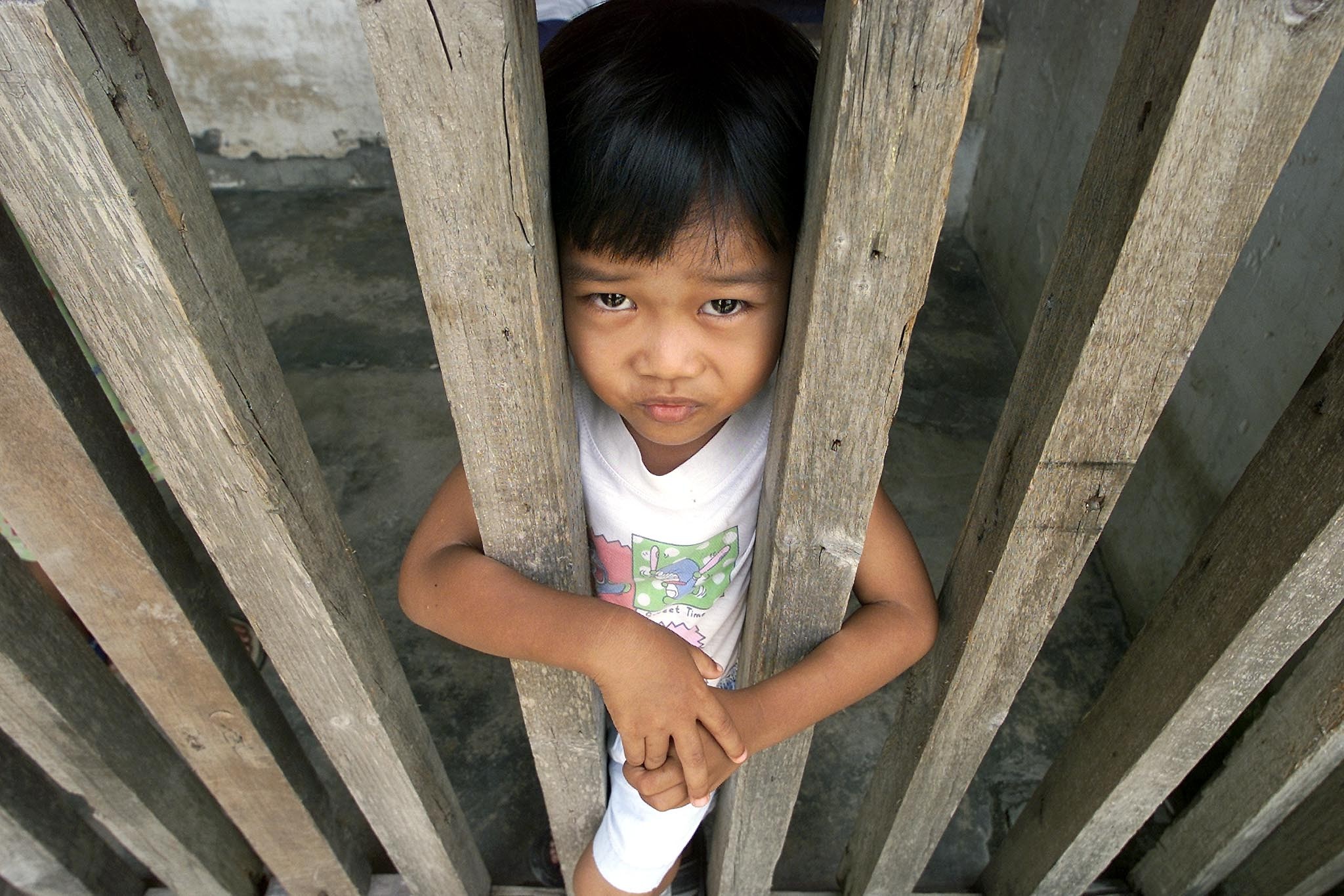 A boy at his house in a poor Malay squatter settlement in Kuala Lumpur. Photo: AFP