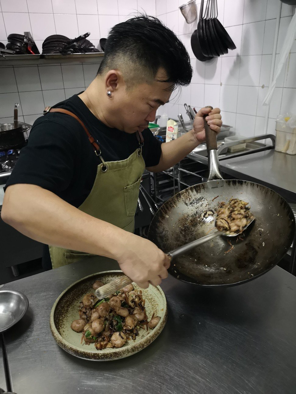 Chef Pang making the abacus seeds dish. Photo: Pang’s Hakka Delicacies