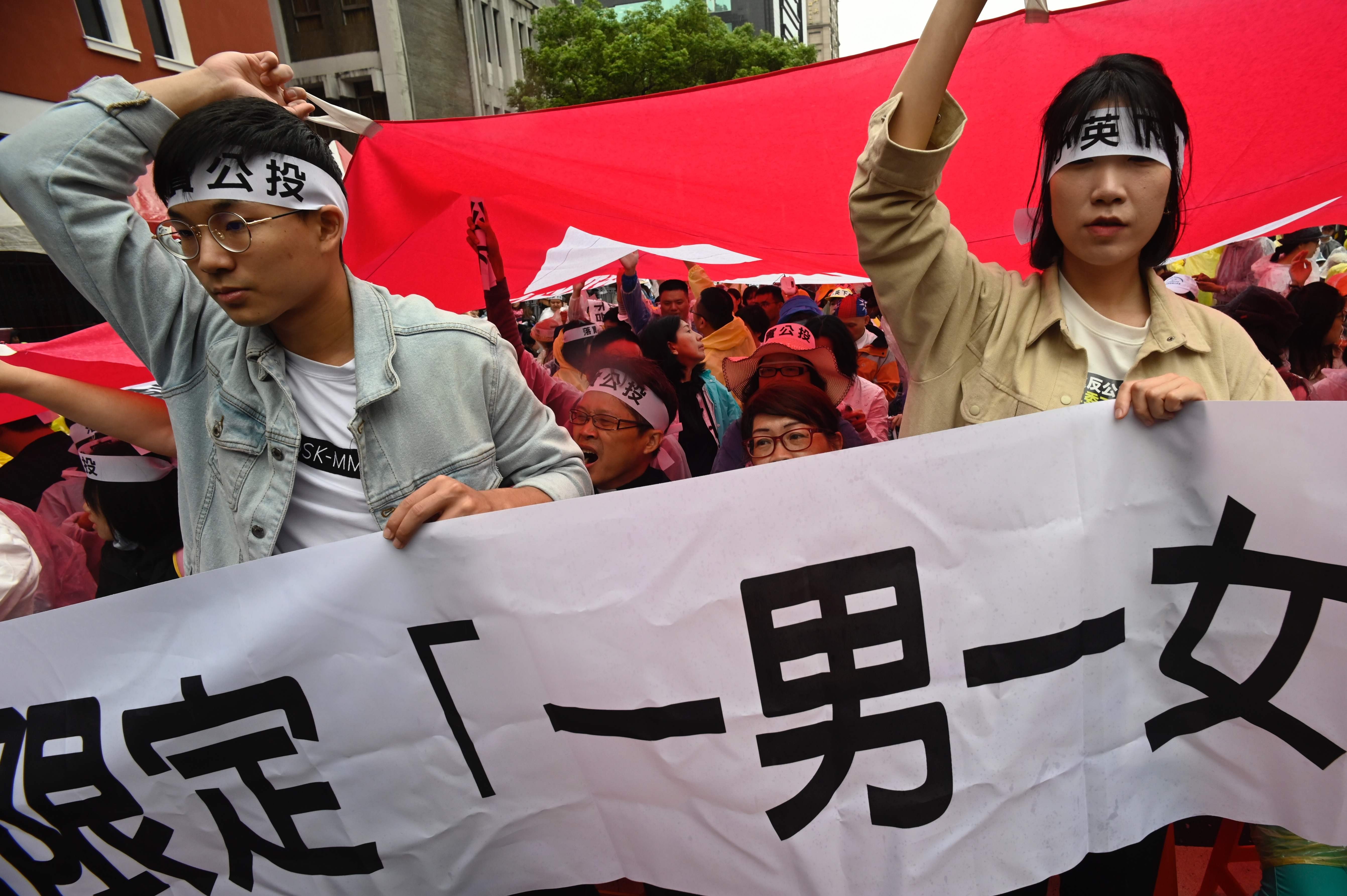 Anti-gay-marriage protesters rally outside the Taiwanese legislature in Taipei on May 8. Lawmakers are expected to vote this Friday on three draft bills that would implement a Constitutional Court ruling in 2017 legalising same-sex marriage. Photo: AFP